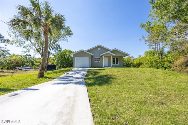 view of front of property with an attached garage, driveway, and a front lawn