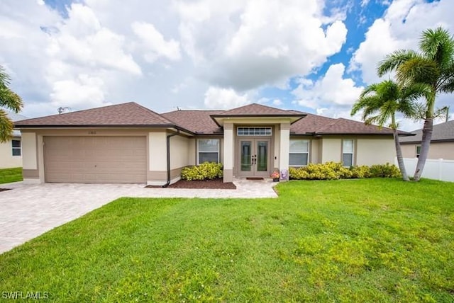 view of front of home with a garage, french doors, decorative driveway, and stucco siding