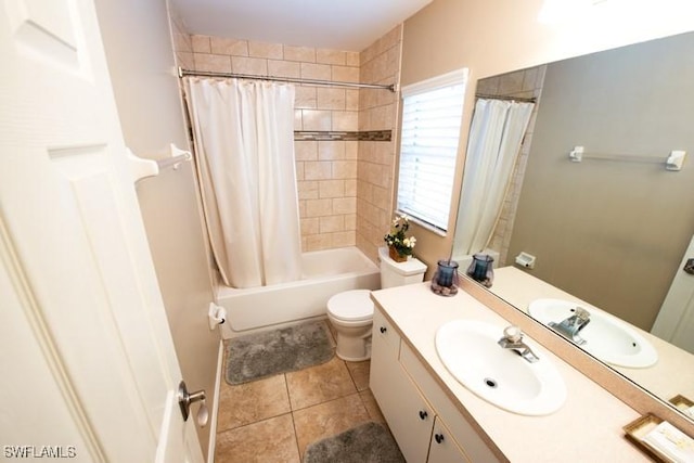 bathroom featuring toilet, tile patterned flooring, shower / bath combination with curtain, and vanity