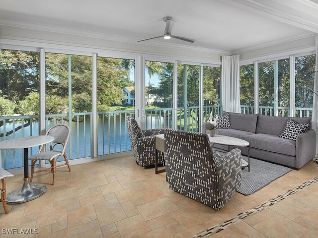 sunroom / solarium featuring ceiling fan