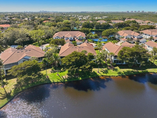 birds eye view of property featuring a water view and a residential view