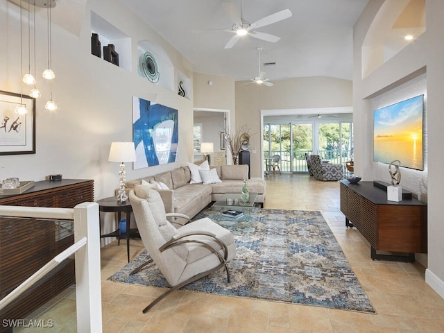 living room featuring high vaulted ceiling and a ceiling fan