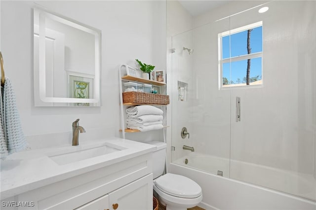 full bathroom with bathtub / shower combination, vanity, and toilet