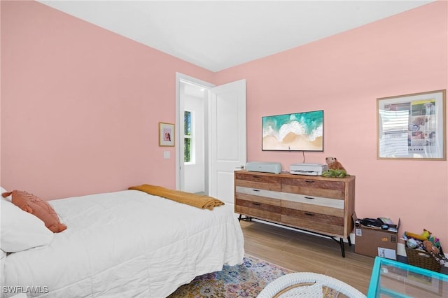 bedroom featuring wood finished floors