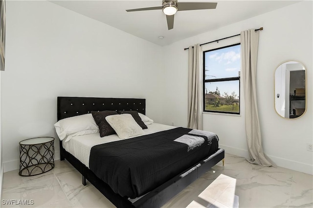 bedroom featuring baseboards, marble finish floor, and ceiling fan