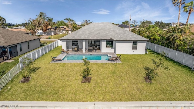 view of pool with a yard, a fenced in pool, a patio, and a fenced backyard