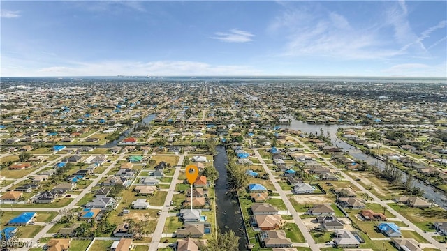 birds eye view of property with a residential view