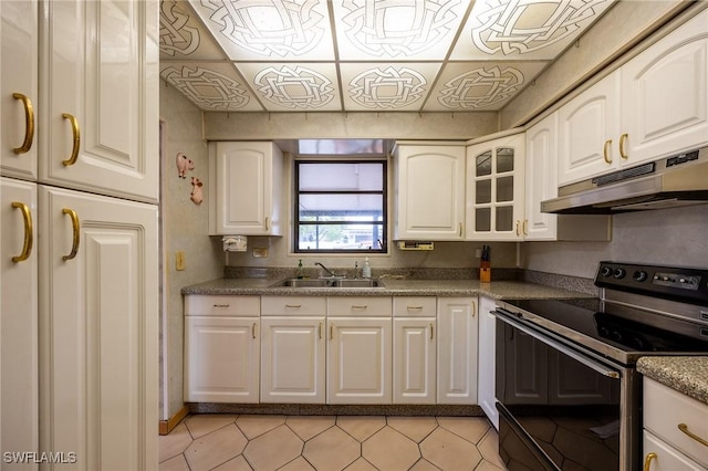 kitchen with white cabinets, electric stove, an ornate ceiling, under cabinet range hood, and a sink