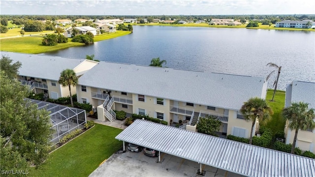 aerial view featuring a water view and a residential view