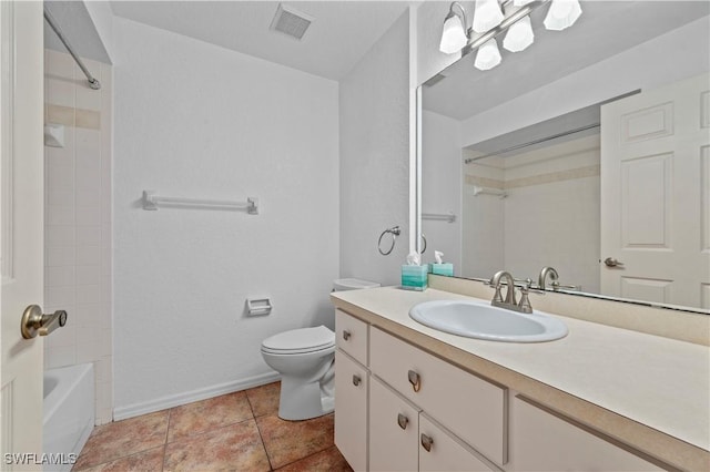 bathroom featuring vanity, baseboards, visible vents, tile patterned floors, and toilet