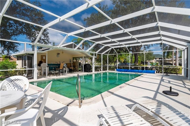 pool featuring a lanai and a patio area