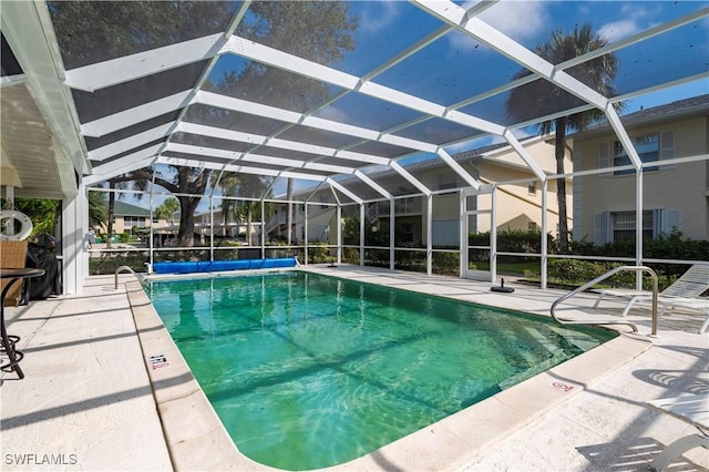 pool with a patio and a lanai