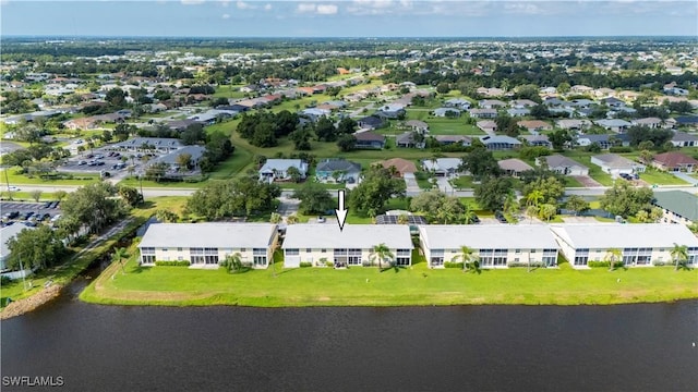 birds eye view of property with a residential view and a water view