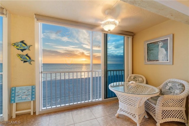 interior space with a water view and tile patterned flooring