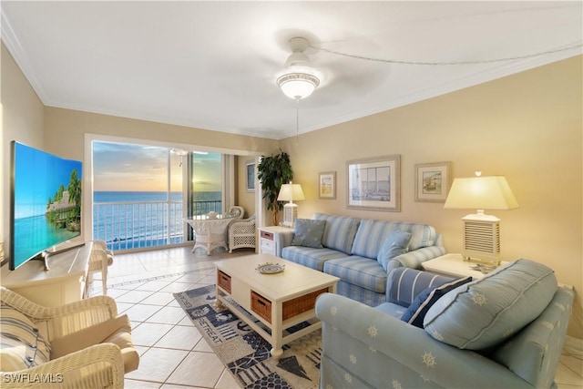 living area with light tile patterned floors, crown molding, and a ceiling fan