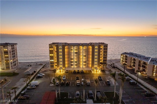 aerial view at dusk with a water view