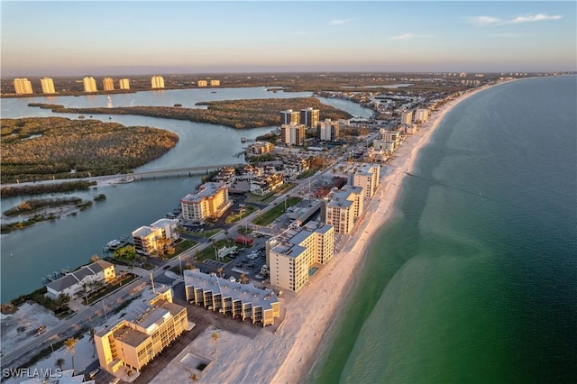 aerial view featuring a city view, a beach view, and a water view