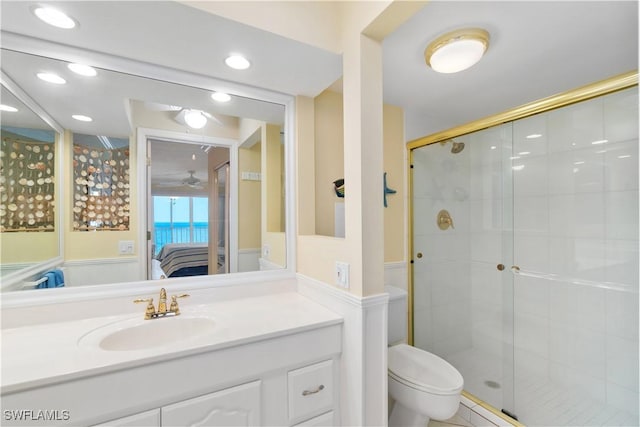 full bath with toilet, recessed lighting, connected bathroom, a shower stall, and vanity