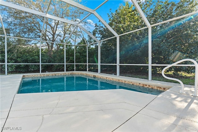 pool featuring a lanai and a patio area