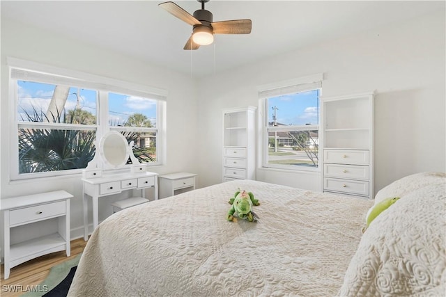 bedroom with wood finished floors and a ceiling fan