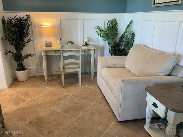 tiled home office with wainscoting and a decorative wall