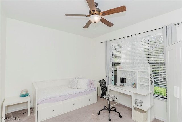 bedroom featuring a ceiling fan, baseboards, and carpet floors