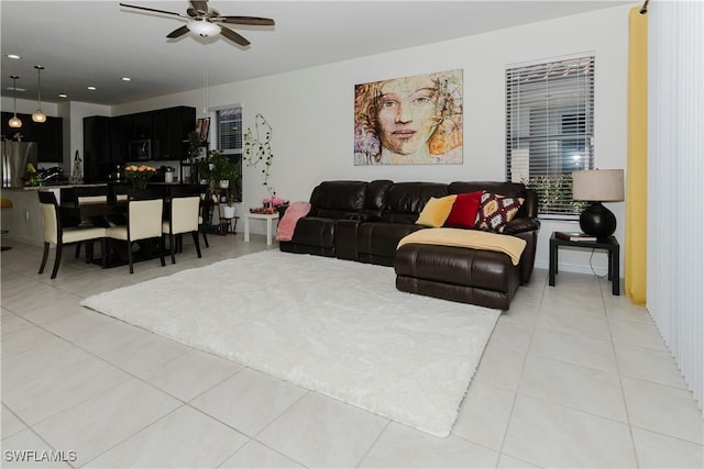 living area featuring light tile patterned floors, recessed lighting, and a ceiling fan