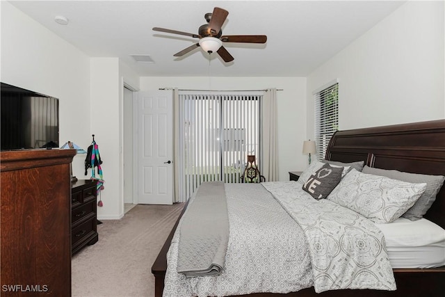 bedroom featuring visible vents, light carpet, ceiling fan, and access to outside