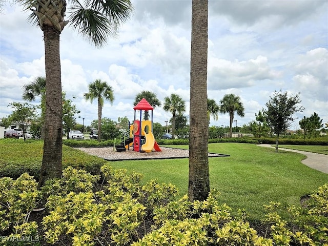 communal playground featuring a lawn