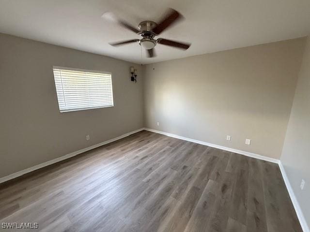 1008 SW 37th Ter, Cape Coral, FL 33914 - spare room featuring ceiling fan, wood finished floors, and baseboards