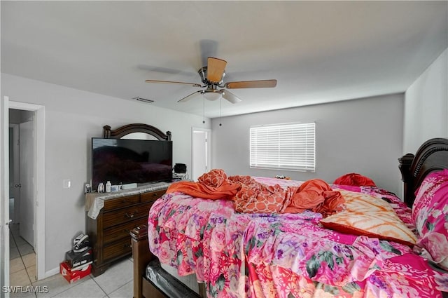 bedroom featuring ceiling fan, visible vents, and light tile patterned flooring