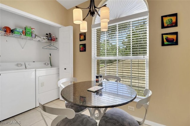 22741 Sandy Bay Dr Unit 201, Estero, FL 33928 - dining room featuring washer and dryer, an inviting chandelier, and light tile patterned flooring
