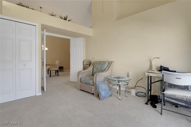 22741 Sandy Bay Dr Unit 201, Estero, FL 33928 - sitting room with a high ceiling and carpet flooring