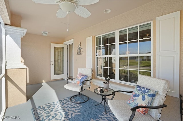 view of patio / terrace featuring a ceiling fan and visible vents