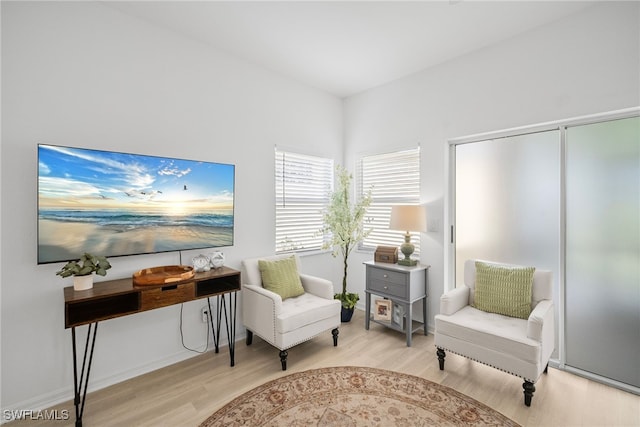 10735 Blue Bimini Cir, Estero, FL 33928 - sitting room with wood finished floors