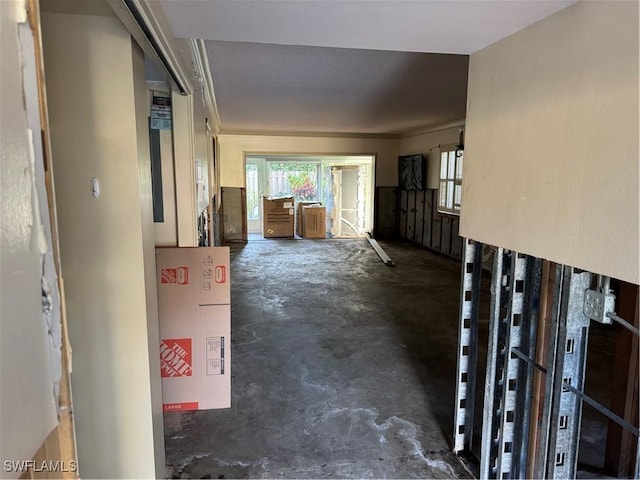 hallway with concrete floors