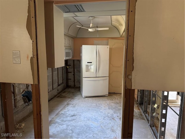 kitchen featuring white fridge with ice dispenser, unfinished concrete flooring, visible vents, and a ceiling fan