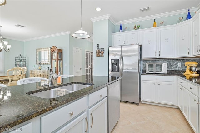 kitchen featuring stainless steel appliances, visible vents, and white cabinetry