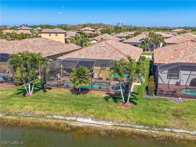 aerial view featuring a residential view and a water view