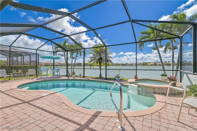 view of pool featuring glass enclosure, a patio area, a pool with connected hot tub, and a water view