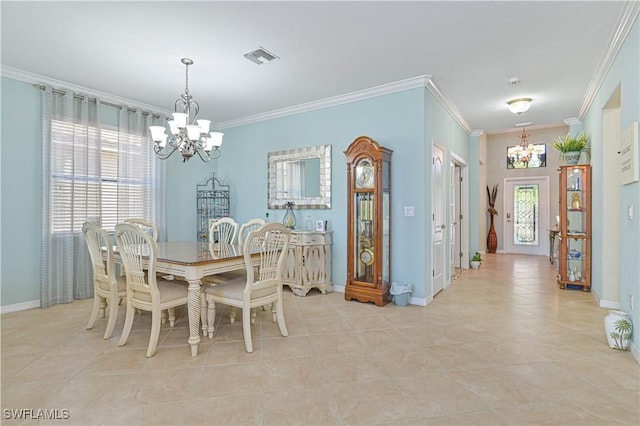 dining space featuring visible vents, a chandelier, and crown molding