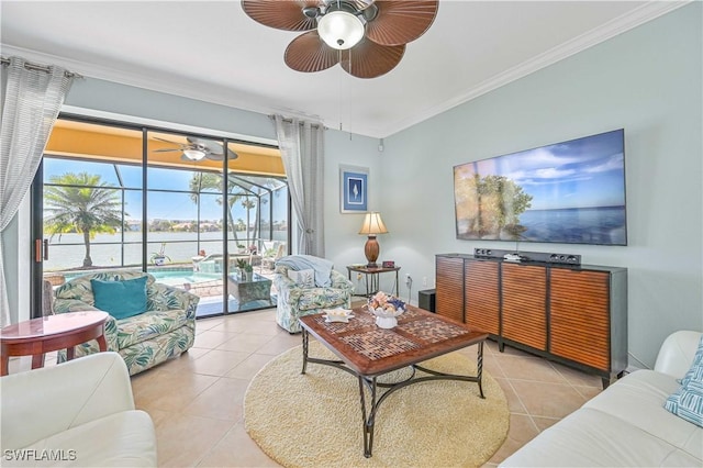 living room featuring a sunroom, ceiling fan, ornamental molding, and tile patterned floors