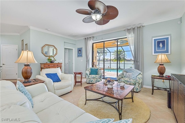 living area featuring a ceiling fan, light tile patterned flooring, crown molding, and baseboards