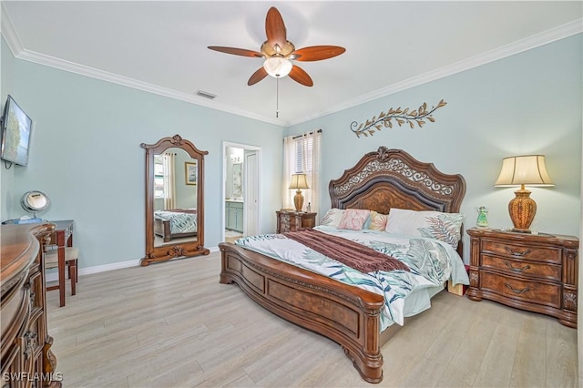 bedroom featuring ornamental molding, visible vents, baseboards, and wood finished floors