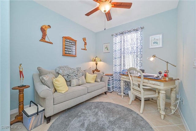 tiled home office with ceiling fan and baseboards