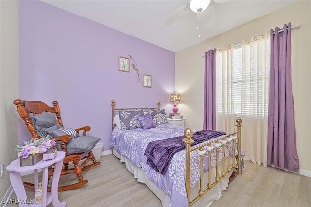 bedroom featuring ceiling fan, wood finished floors, and baseboards