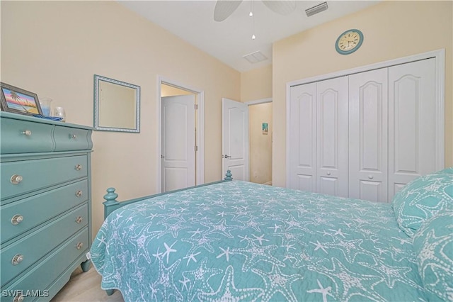 bedroom with a ceiling fan, a closet, and visible vents