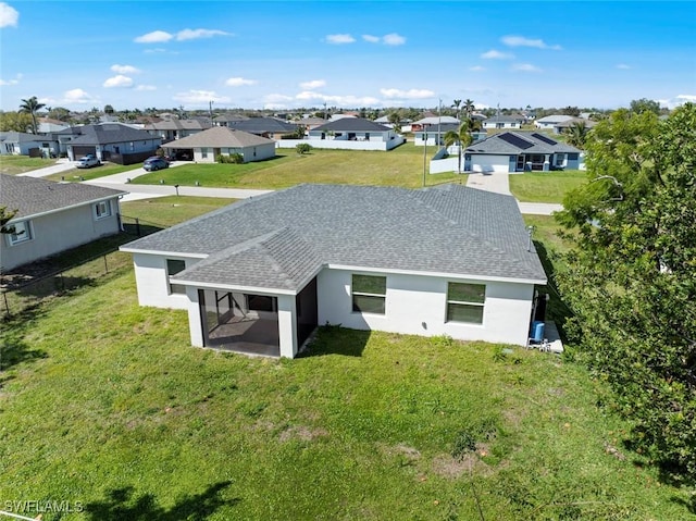 birds eye view of property with a residential view