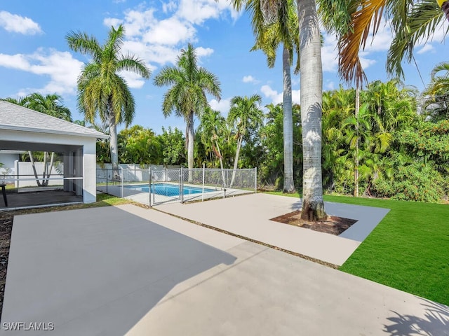 view of pool featuring a fenced in pool, a yard, a patio, and fence