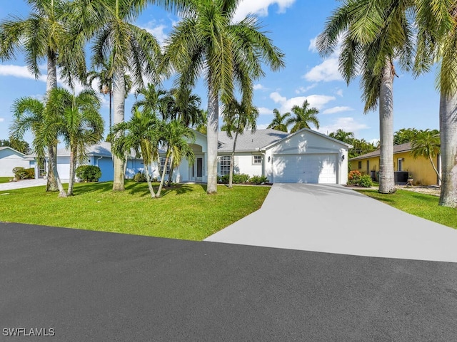 ranch-style home with an attached garage, driveway, and a front yard